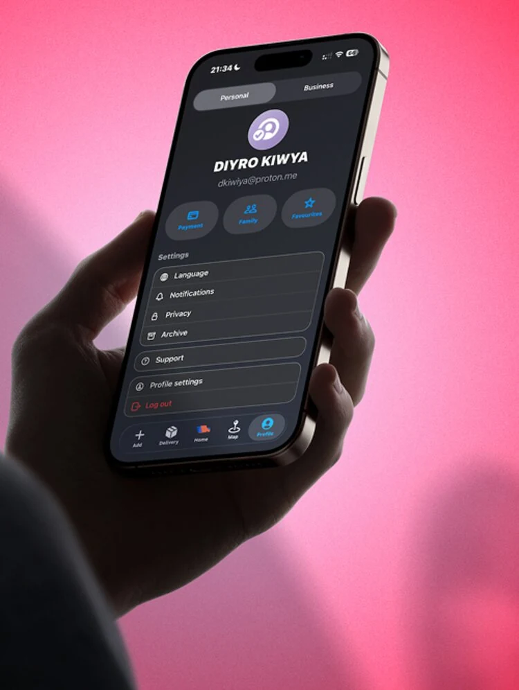 Hand holding a phone showing the Twist Express profile screen against a red backdrop.
